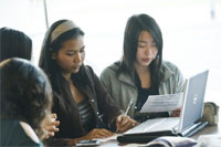 Student group working on a laptop